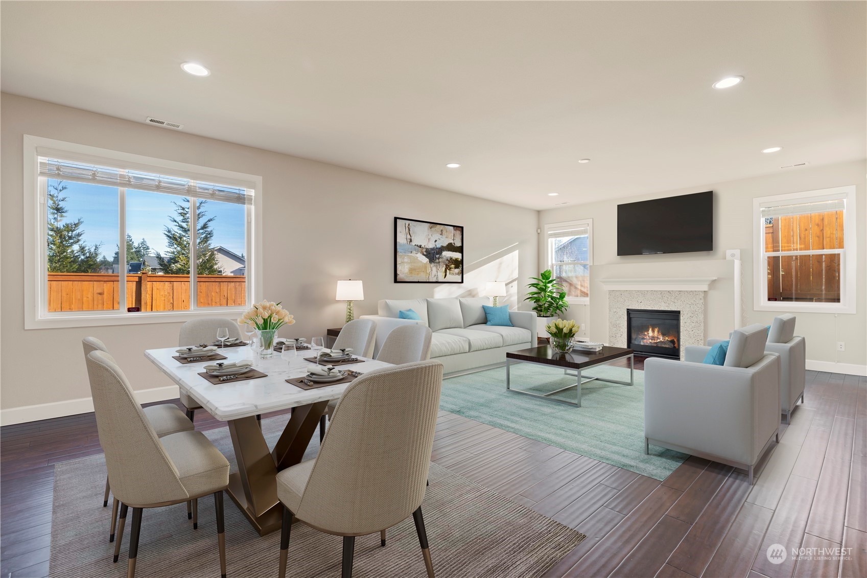 3312 170th Place Southeast Bothell, WA 98012 - Photo 8 of 29 a dining room with furniture a fireplace and wooden floor