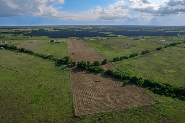 a view of a lake with a yard