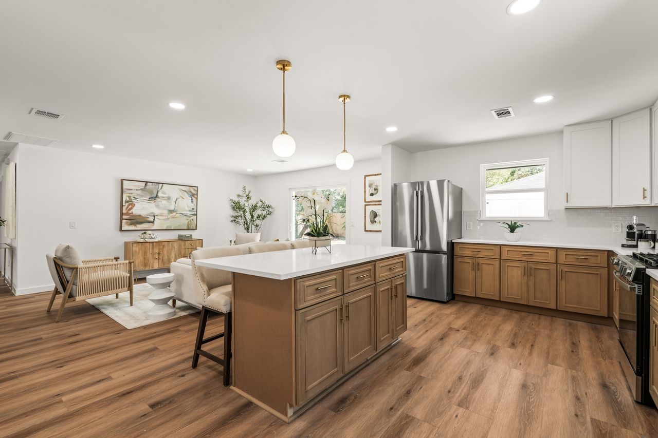 5207 Hummingbird Street Houston, TX 77035 - Photo 4 of 23 oversized quartz island with seating creates the perfect centerpiece for everyday living and entertaining