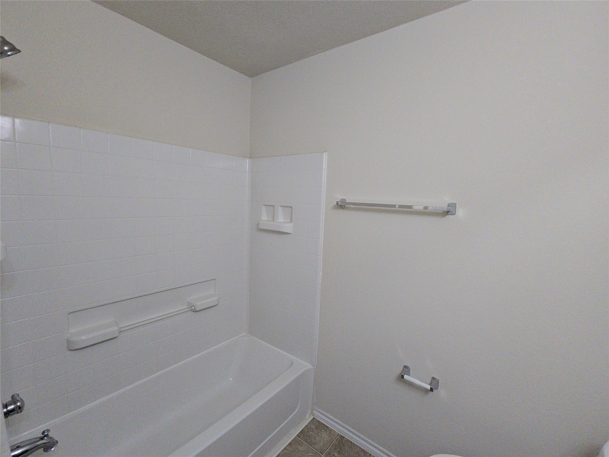 810 Lightningbug Lane Conroe, TX 77301 - Photo 17 of 27 a view of a room with racks on the wall