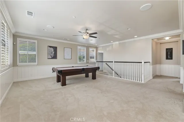 a kitchen with stainless steel appliances granite countertop a stove a microwave and a sink