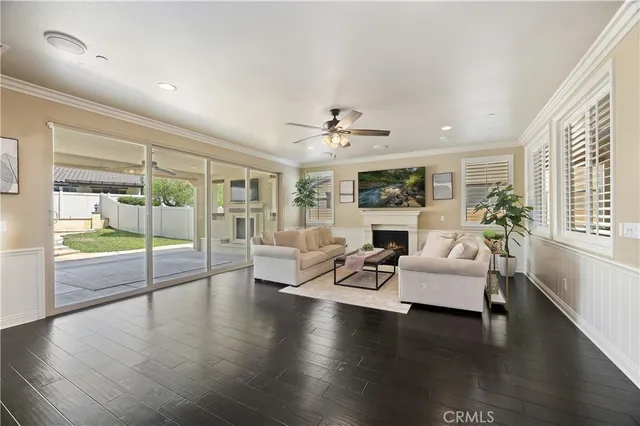 a kitchen with lots of counter top space and painting on the wall