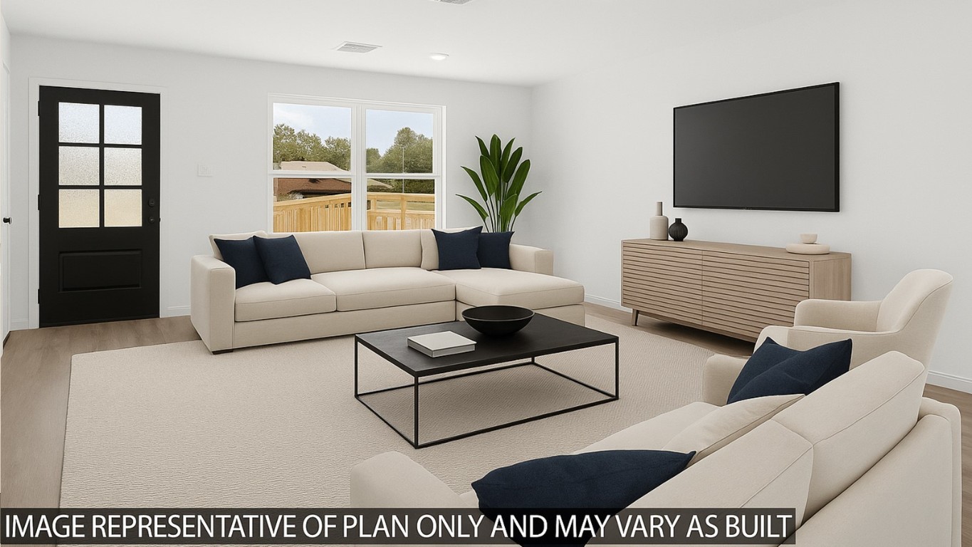 13150 Turret Bend Way Willis, TX 77378 - Photo 2 of 9 a living room with furniture and a flat screen tv