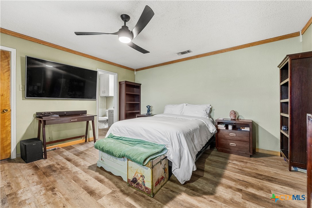 3216 Wendy Lane Kempner, TX 76539 - Photo 11 of 23 a bedroom with a bed and a flat screen tv