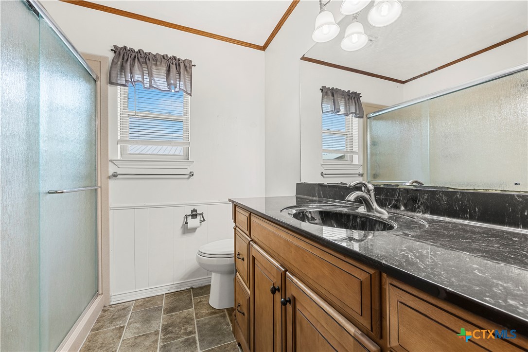 3216 Wendy Lane Kempner, TX 76539 - Photo 15 of 23 a bathroom with a sink a toilet and a mirror