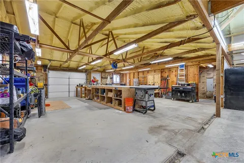 a view of parking garage with cars