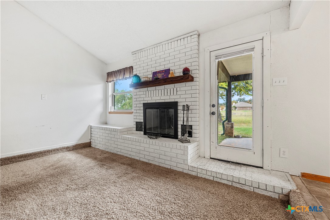 3216 Wendy Lane Kempner, TX 76539 - Photo 5 of 23 an empty room with furniture and a fireplace