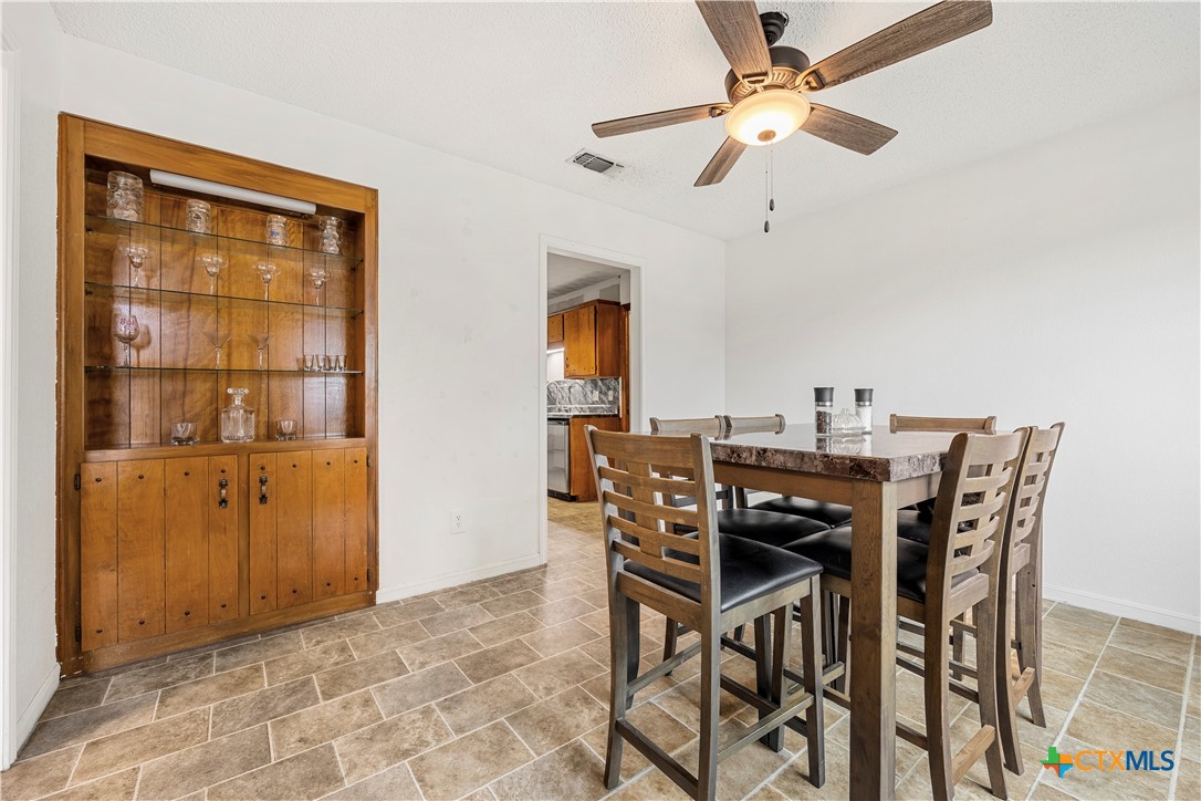 3216 Wendy Lane Kempner, TX 76539 - Photo 10 of 23 a view of a dining room with furniture and a chandelier fan
