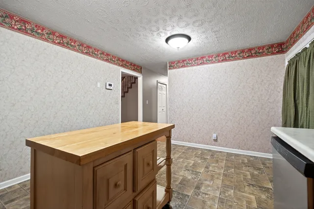 an empty room with closet and mirror