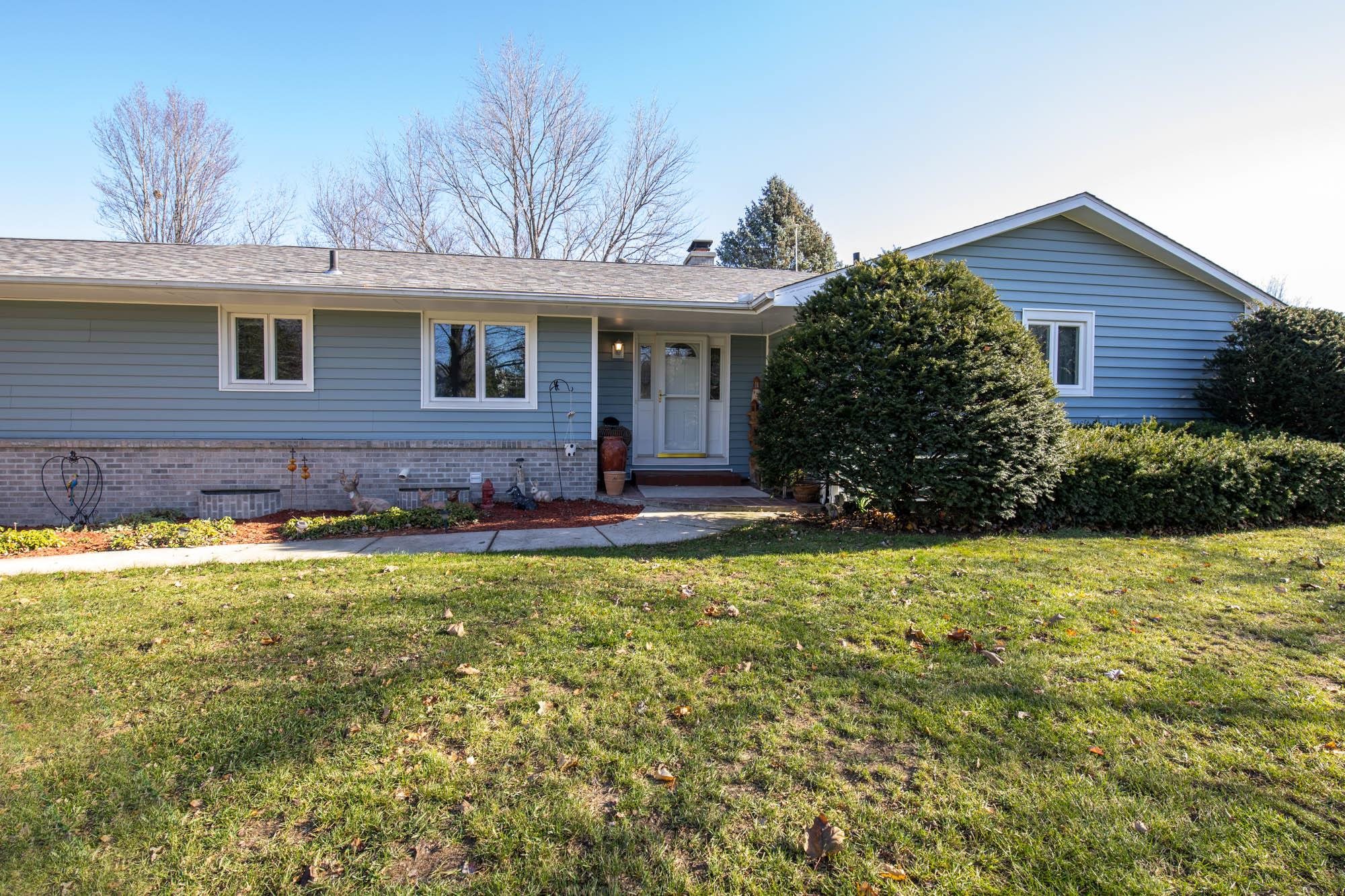90 Lake Summerset Road Lake Summerset, IL 61019 - Photo 1 of 35 a front view of a house with garden