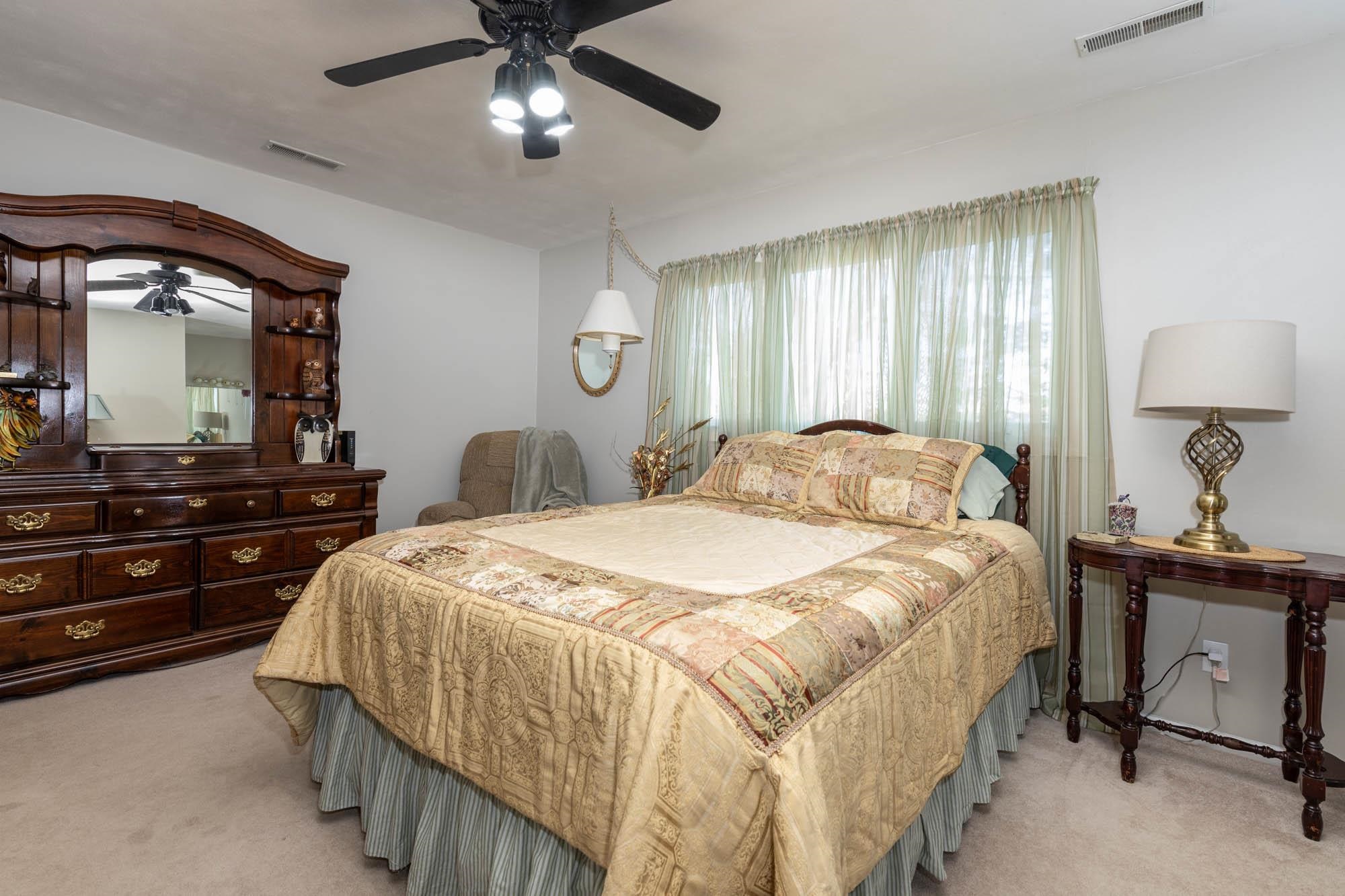 90 Lake Summerset Road Lake Summerset, IL 61019 - Photo 13 of 35 a bedroom with a bed and a dresser