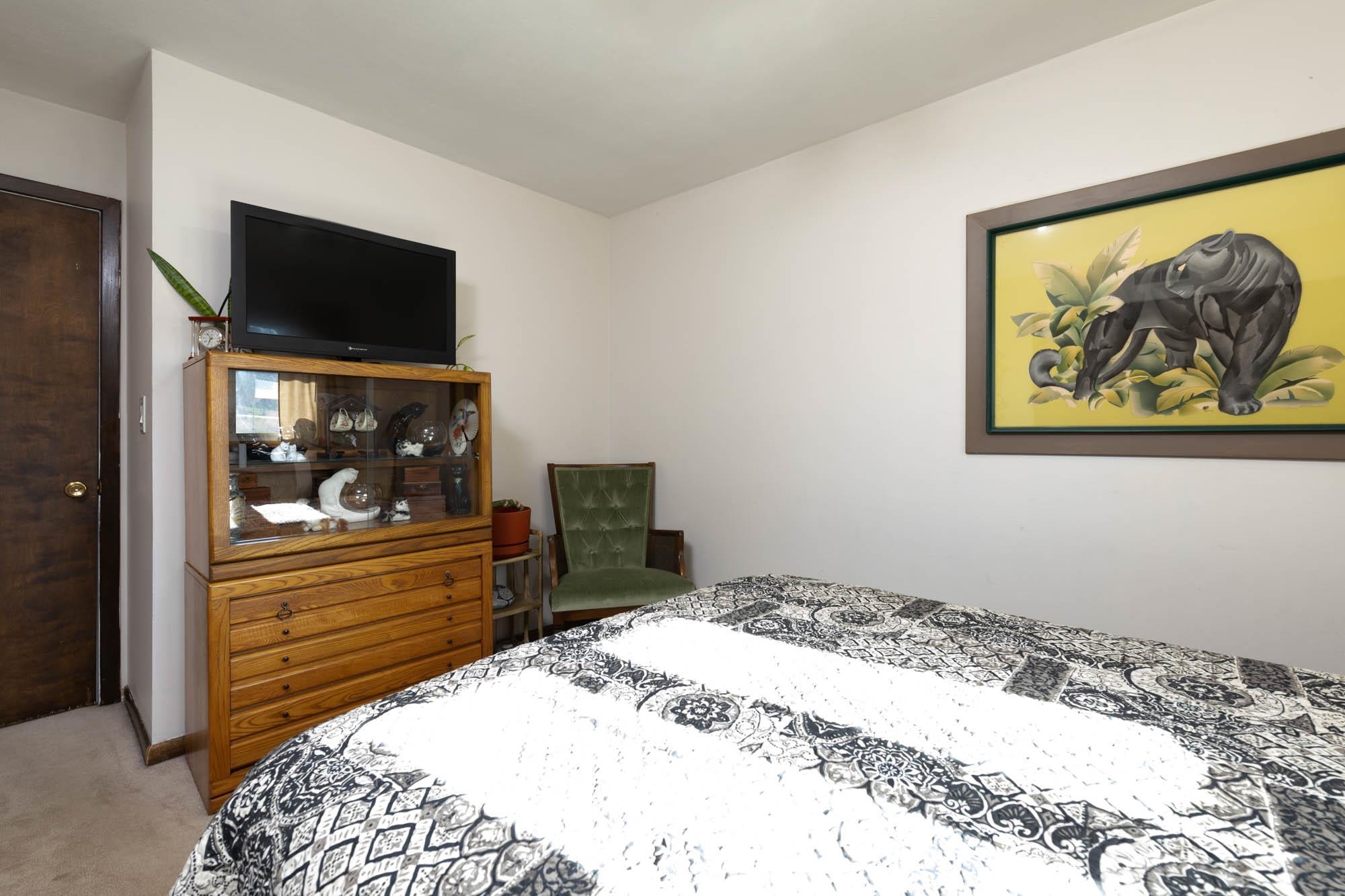 90 Lake Summerset Road Lake Summerset, IL 61019 - Photo 16 of 35 a bedroom with a bed and a flat screen tv