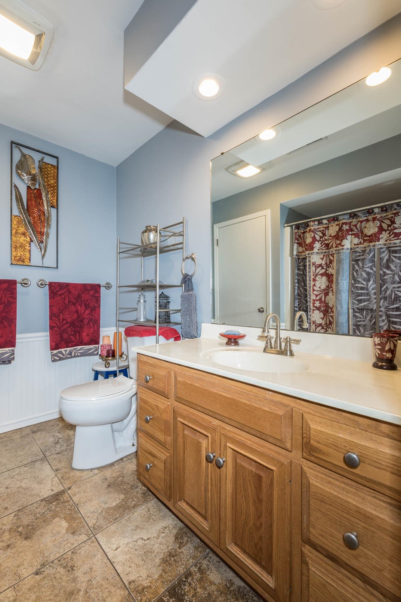 90 Lake Summerset Road Lake Summerset, IL 61019 - Photo 17 of 35 a bathroom with a sink mirror and vanity