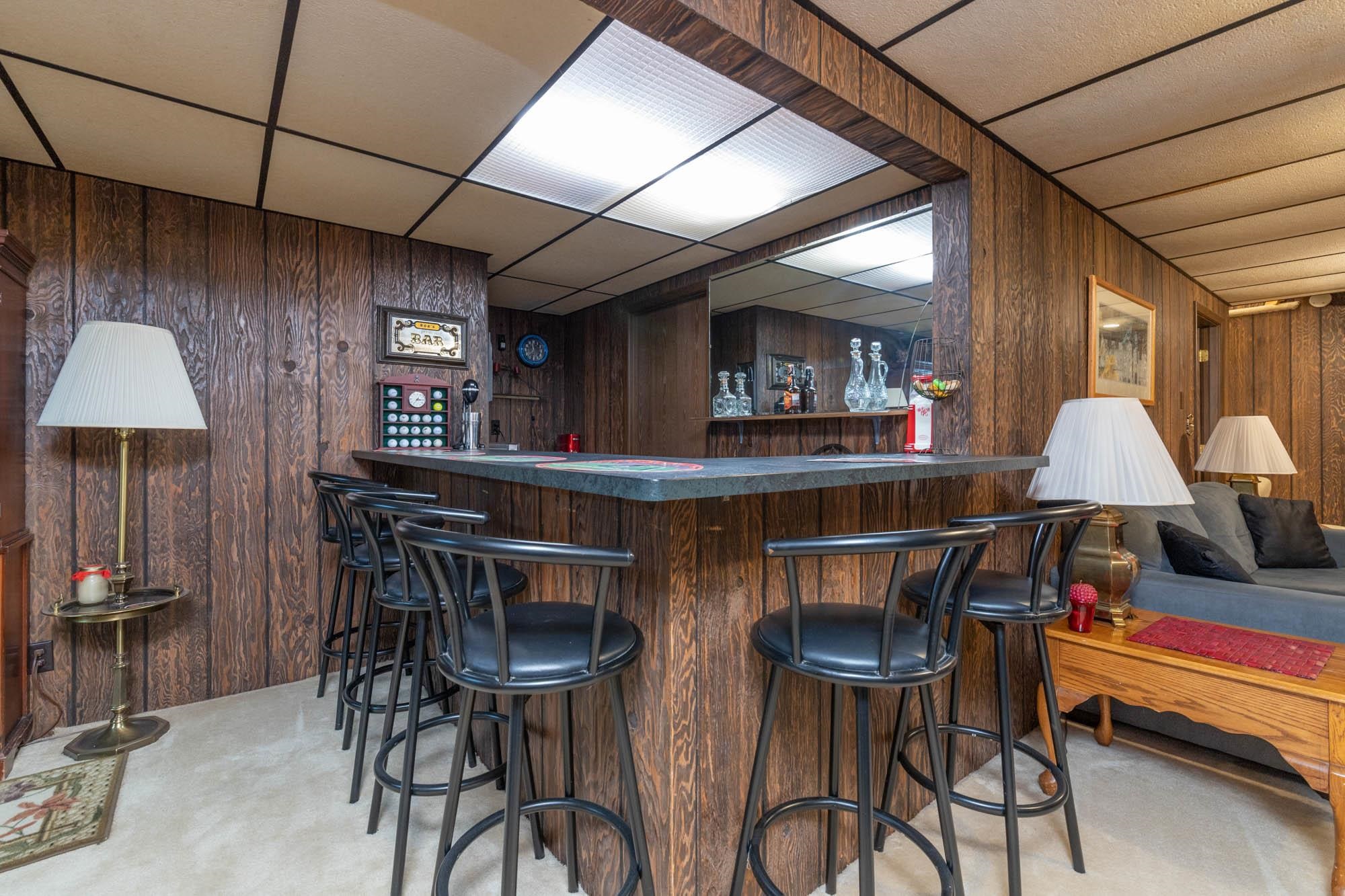 90 Lake Summerset Road Lake Summerset, IL 61019 - Photo 22 of 35 a kitchen with stainless steel appliances a table chairs and a refrigerator