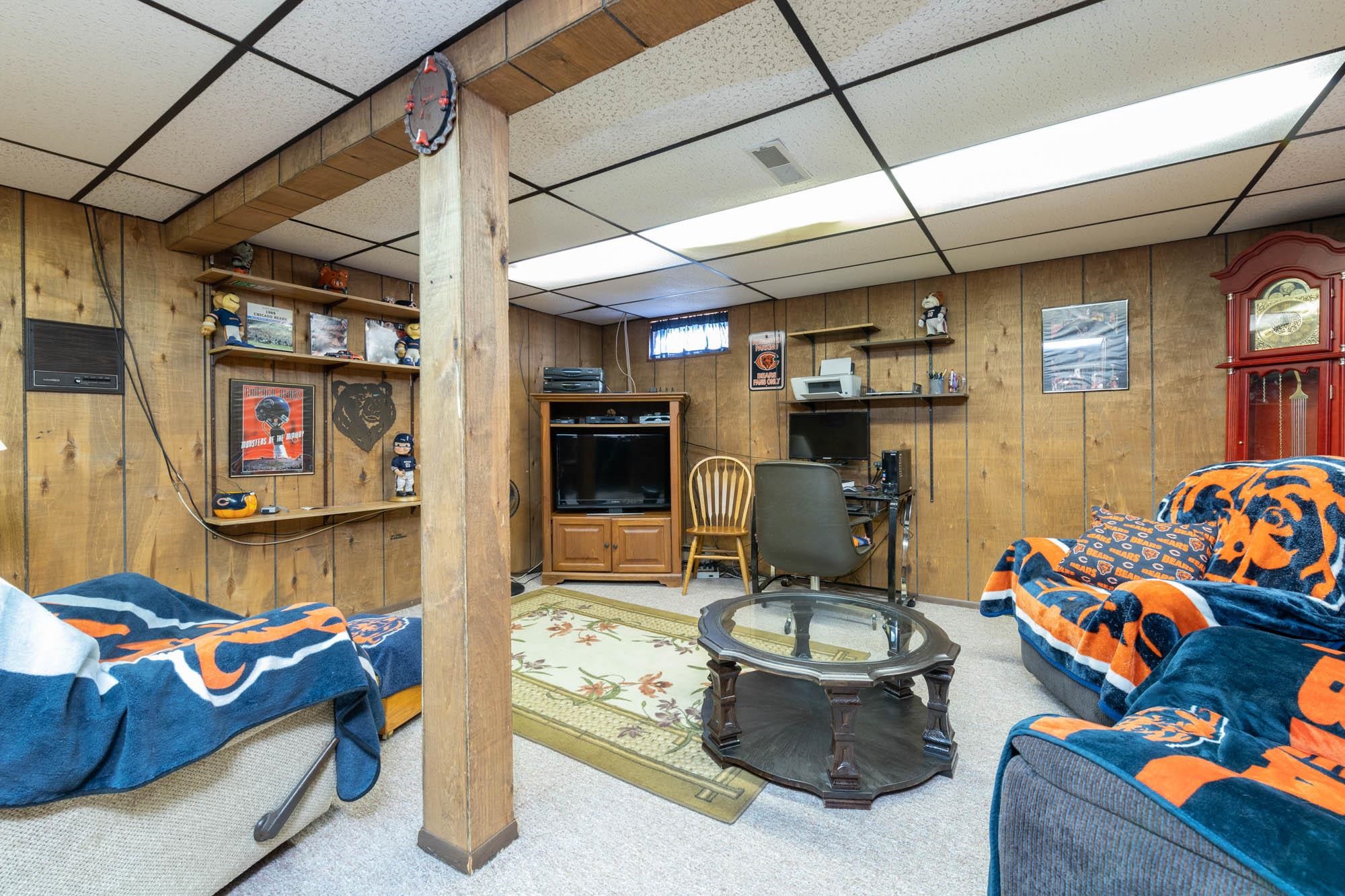 90 Lake Summerset Road Lake Summerset, IL 61019 - Photo 24 of 35 a living room with furniture and a flat screen tv