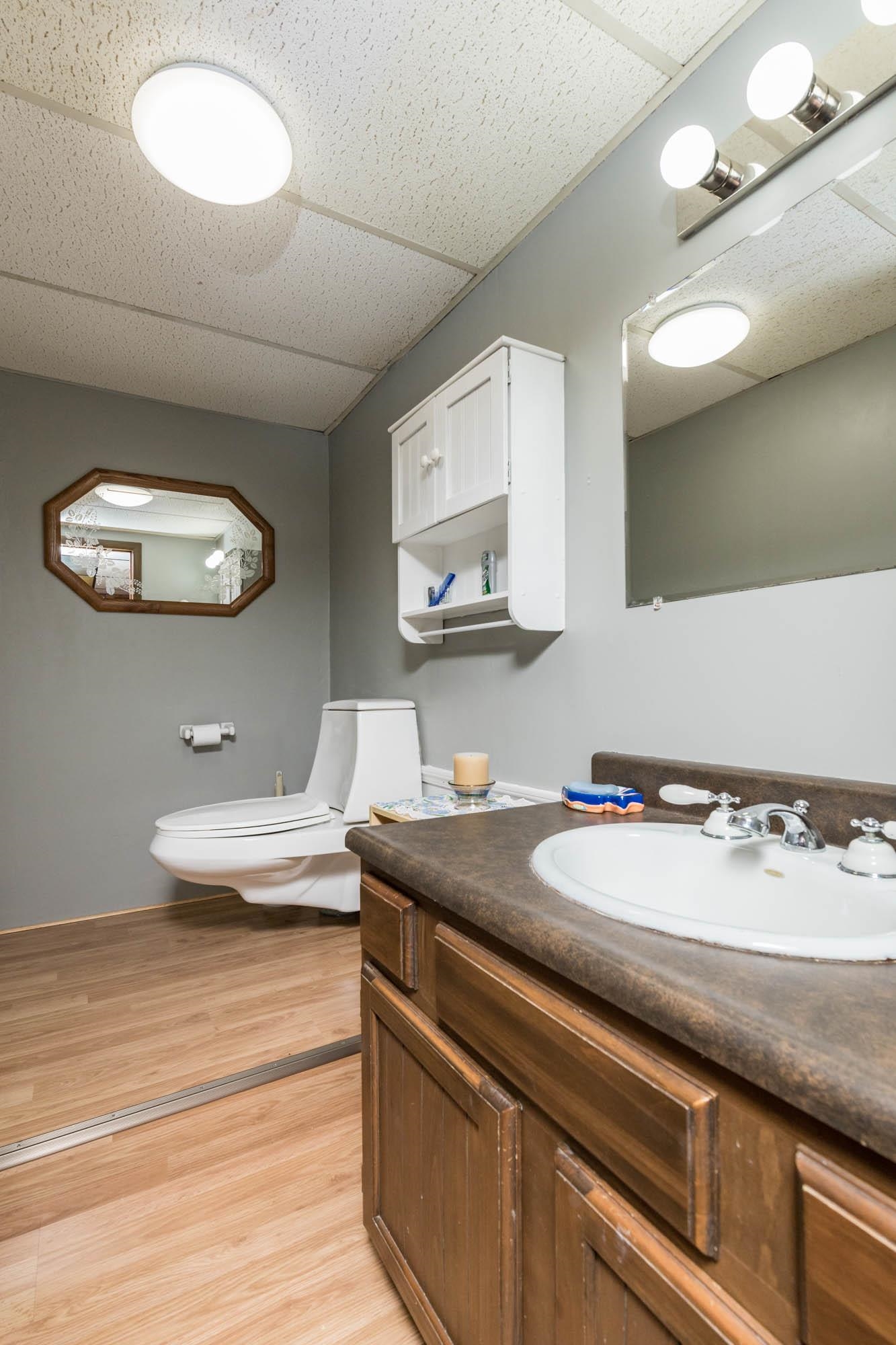 90 Lake Summerset Road Lake Summerset, IL 61019 - Photo 28 of 35 a bathroom with a sink and a mirror