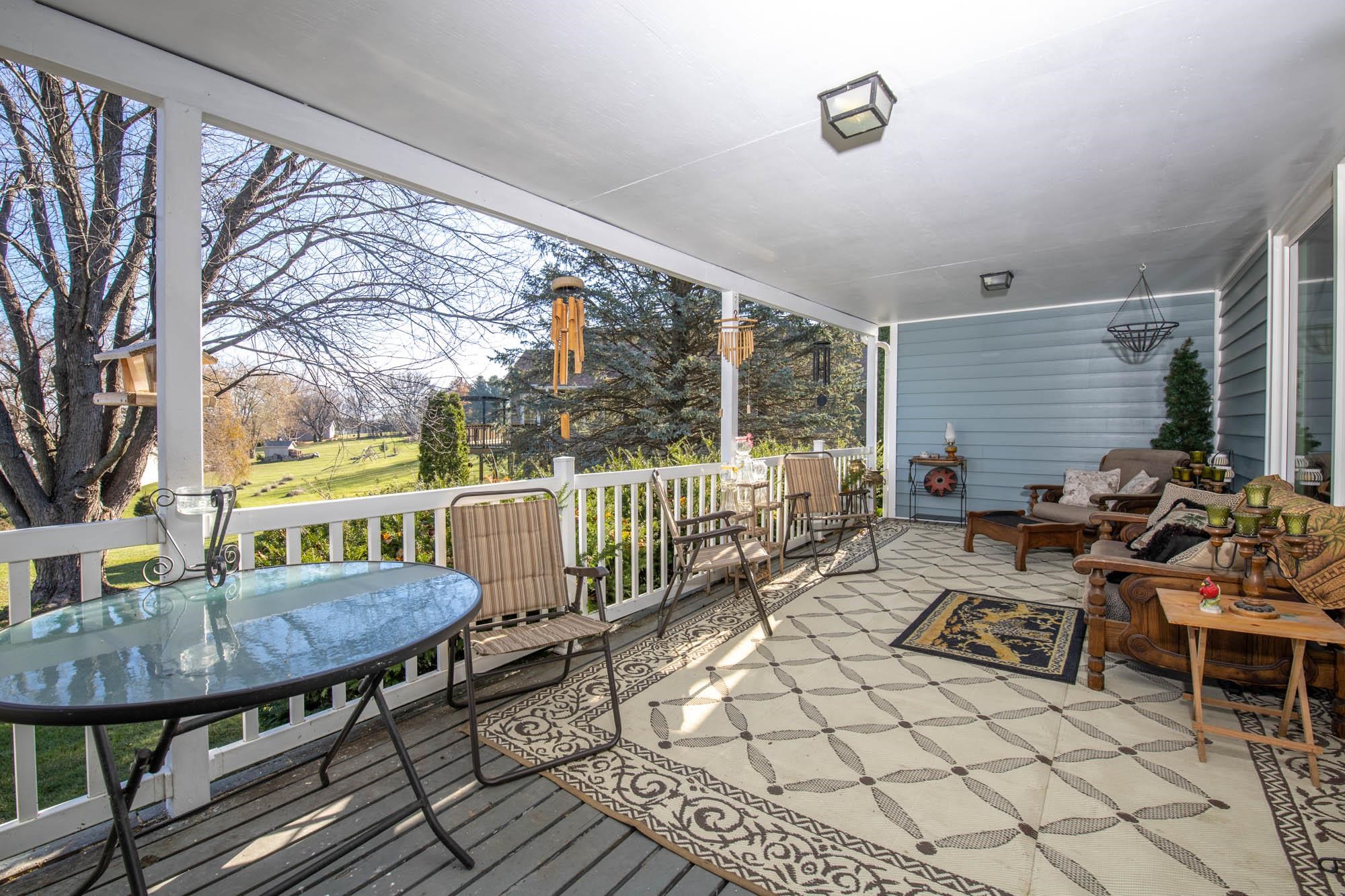 90 Lake Summerset Road Lake Summerset, IL 61019 - Photo 31 of 35 a balcony with chairs and table
