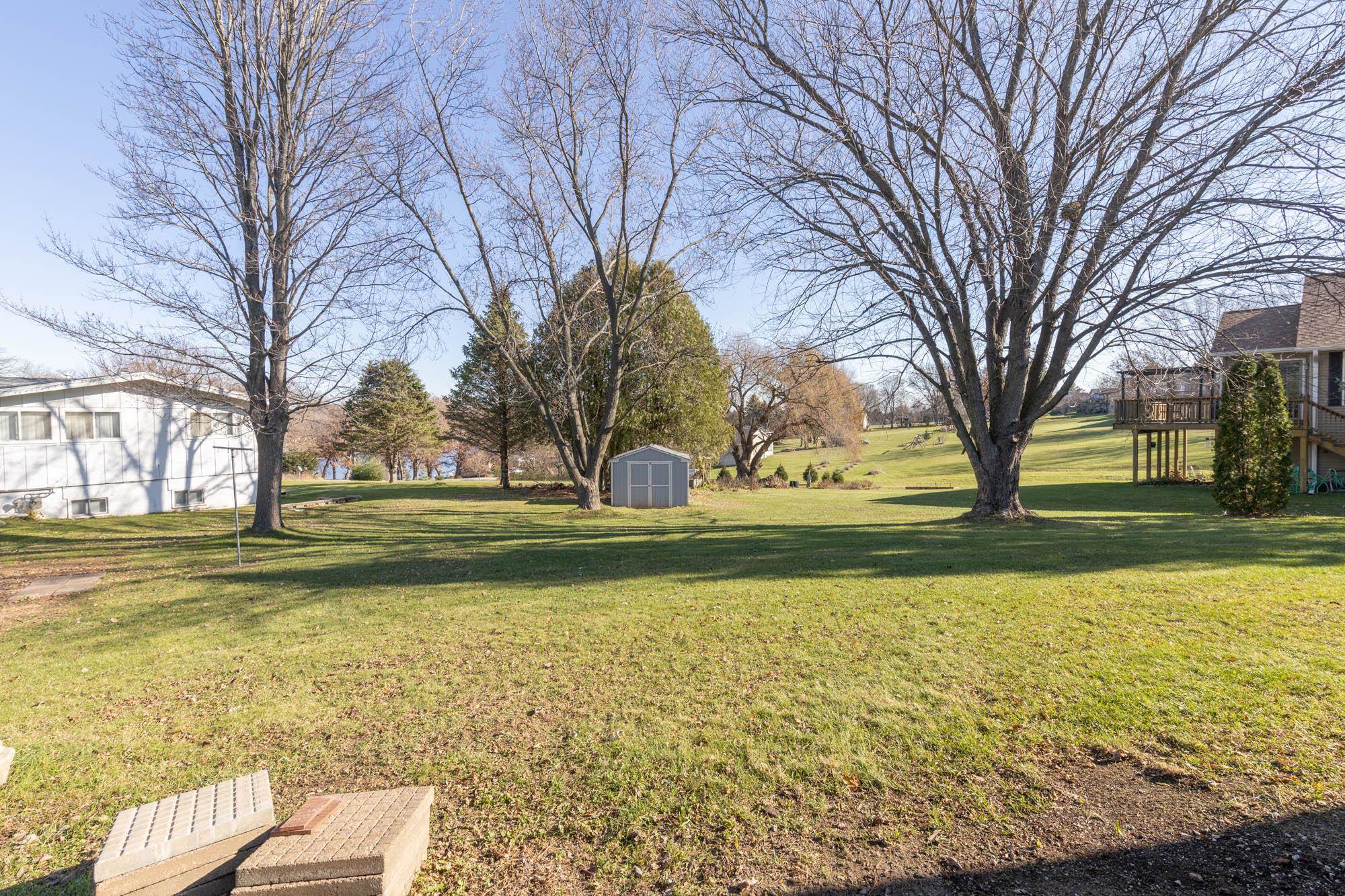90 Lake Summerset Road Lake Summerset, IL 61019 - Photo 33 of 35 a view of a yard with a trees