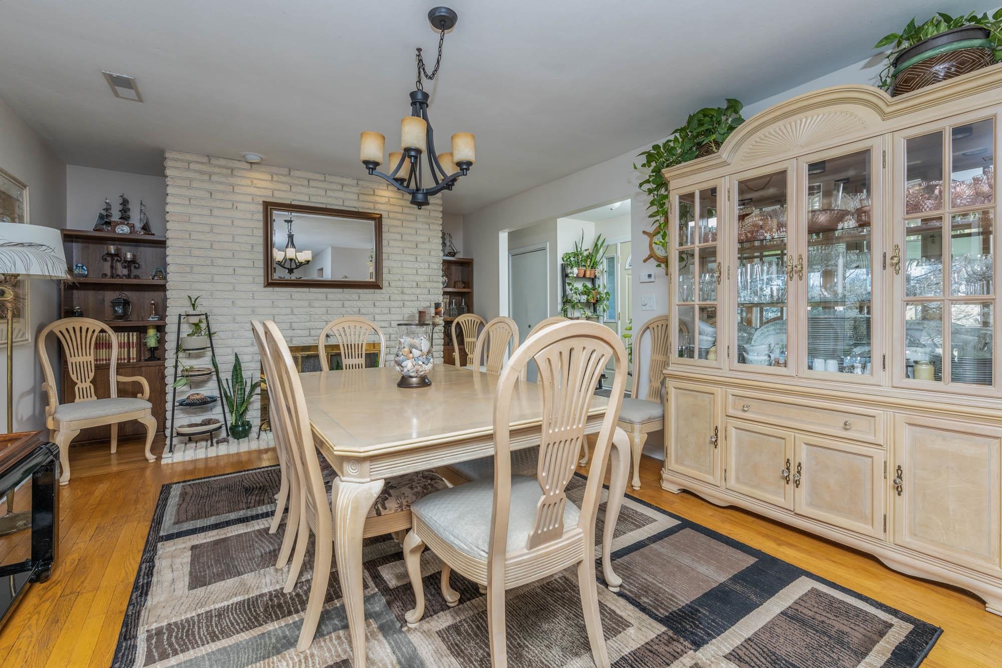 90 Lake Summerset Road Lake Summerset, IL 61019 - Photo 6 of 35 a view of a dining room with furniture wooden floor and chandelier