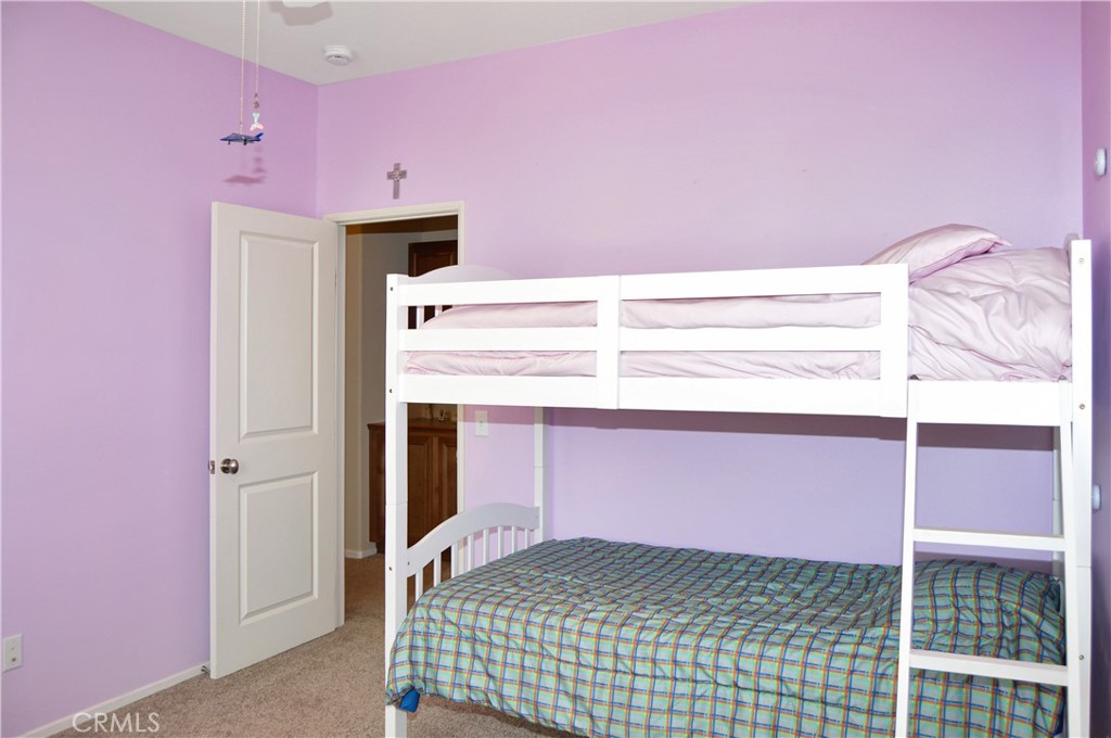 166 Fox Lane Calimesa, CA 92320 - Photo 46 of 76 2nd Bedroom with Ceiling Fan, Walk-in Closet, and Cozy Carpet