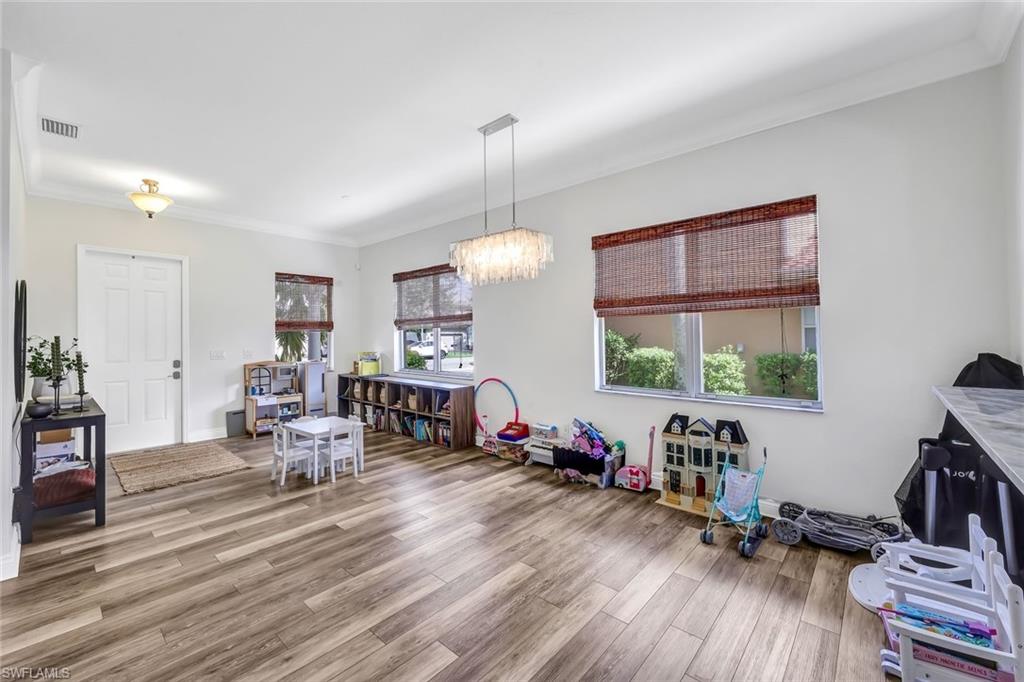 1949 Par Drive Naples, FL 34120 - Photo 14 of 39 a living room with furniture and wooden floor