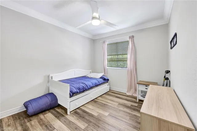 a living room with a couch and a dresser