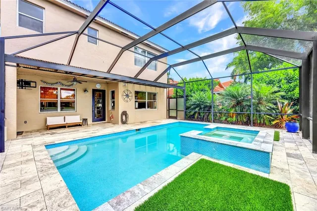 a view of a backyard with a swimming pool