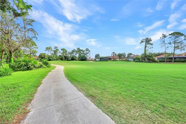 a view of a garden with a building in the background