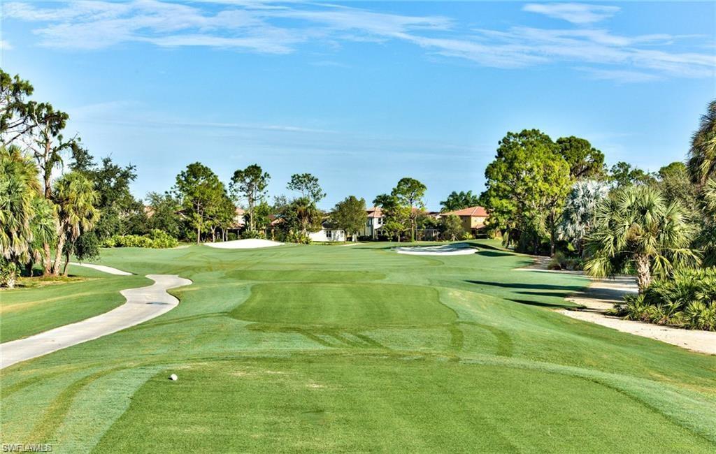 1949 Par Drive Naples, FL 34120 - Photo 36 of 39 a view of a golf course with a lake