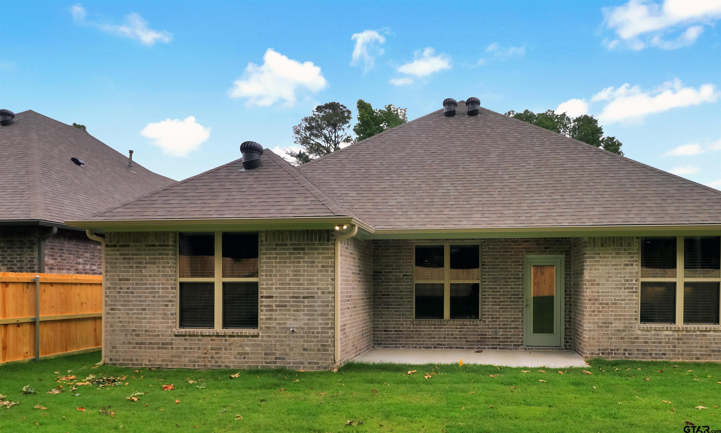 3053 Guinn Farms Road Tyler, TX 75707 - Photo 31 of 32 a view of a house with a yard