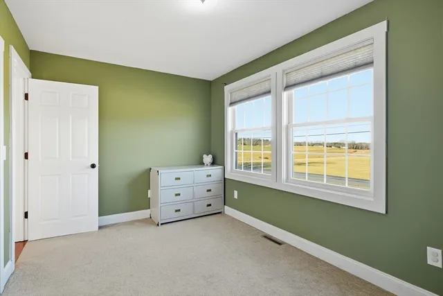 a room with window and bed