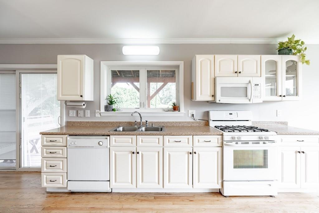 109 New Ludlow Road Granby, MA 01033 - Photo 18 of 42 a kitchen with granite countertop a stove and a sink