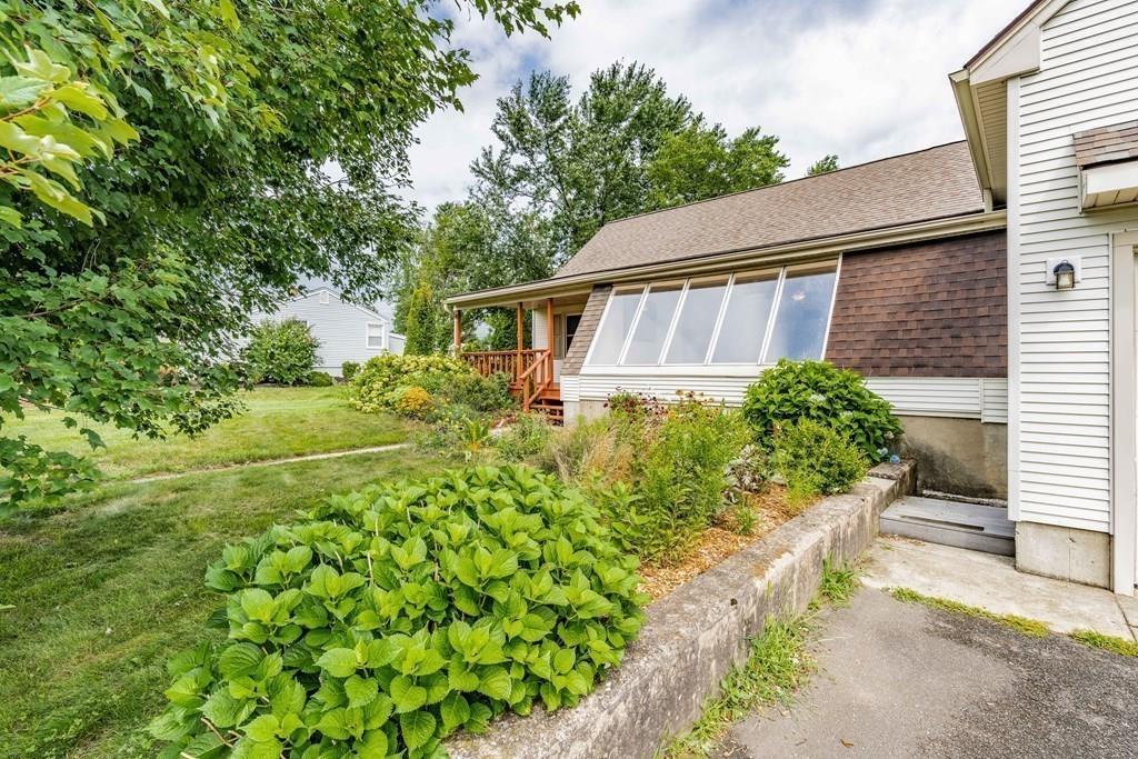 109 New Ludlow Road Granby, MA 01033 - Photo 2 of 42 a view of a backyard with plants