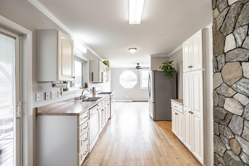 109 New Ludlow Road Granby, MA 01033 - Photo 21 of 42 a large white kitchen with a large window