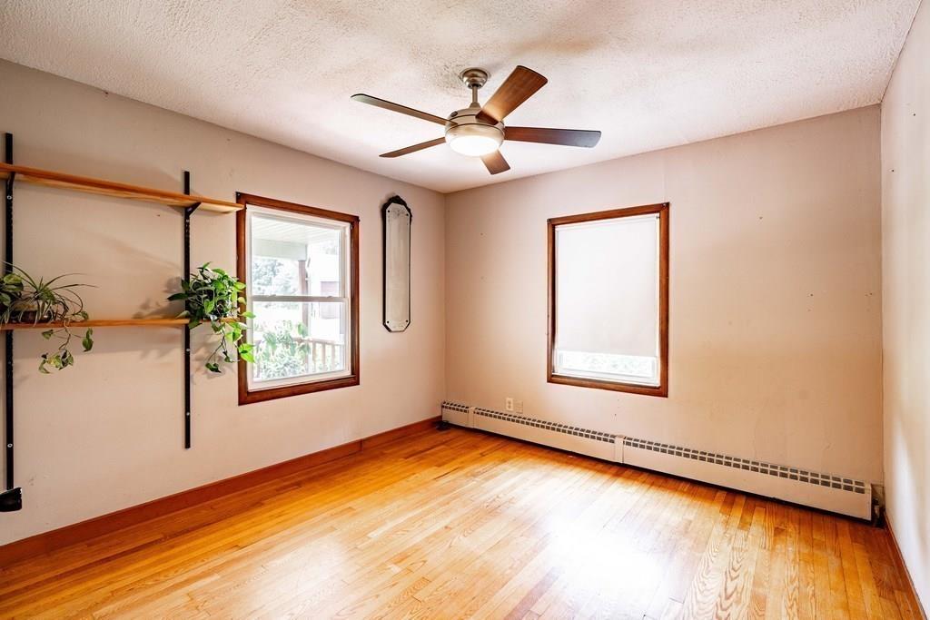 109 New Ludlow Road Granby, MA 01033 - Photo 23 of 42 a view of an empty room with a window and wooden floor