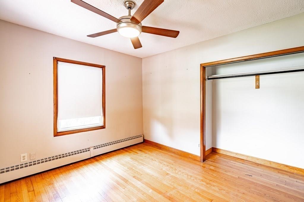 109 New Ludlow Road Granby, MA 01033 - Photo 24 of 42 a view of an empty room with wooden floor and a window