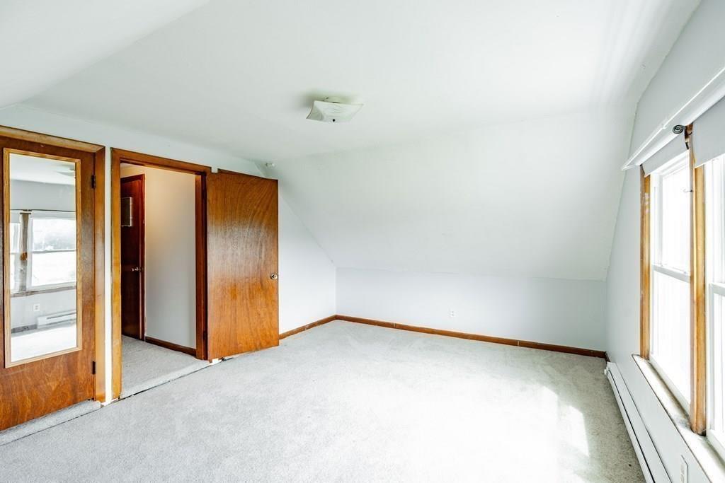 109 New Ludlow Road Granby, MA 01033 - Photo 29 of 42 an empty room with windows