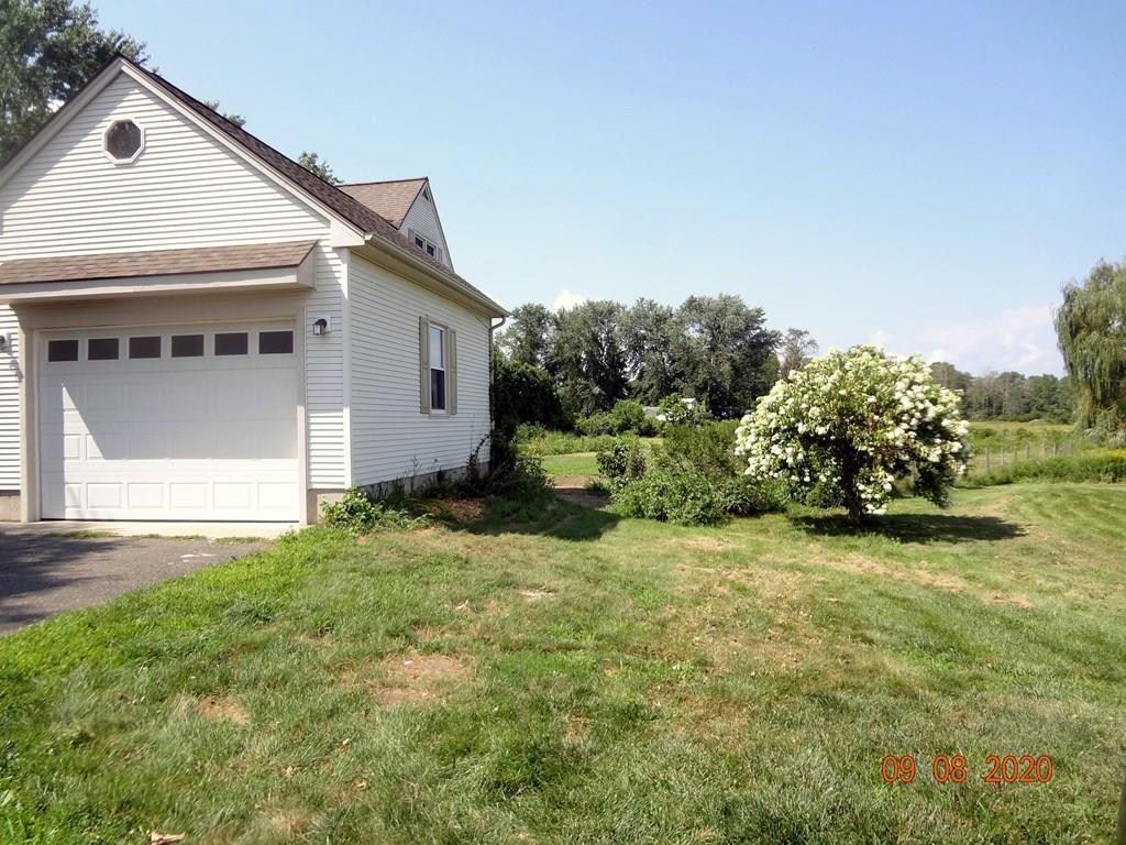 109 New Ludlow Road Granby, MA 01033 - Photo 3 of 42 a house view with a garden space