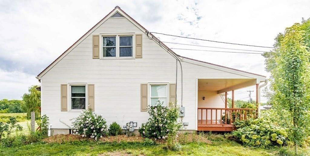 109 New Ludlow Road Granby, MA 01033 - Photo 4 of 42 a front view of a house with garden