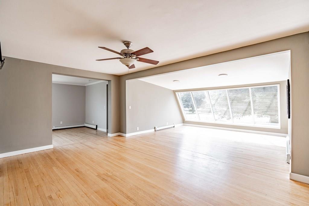 109 New Ludlow Road Granby, MA 01033 - Photo 10 of 42 an empty room with wooden floor and windows
