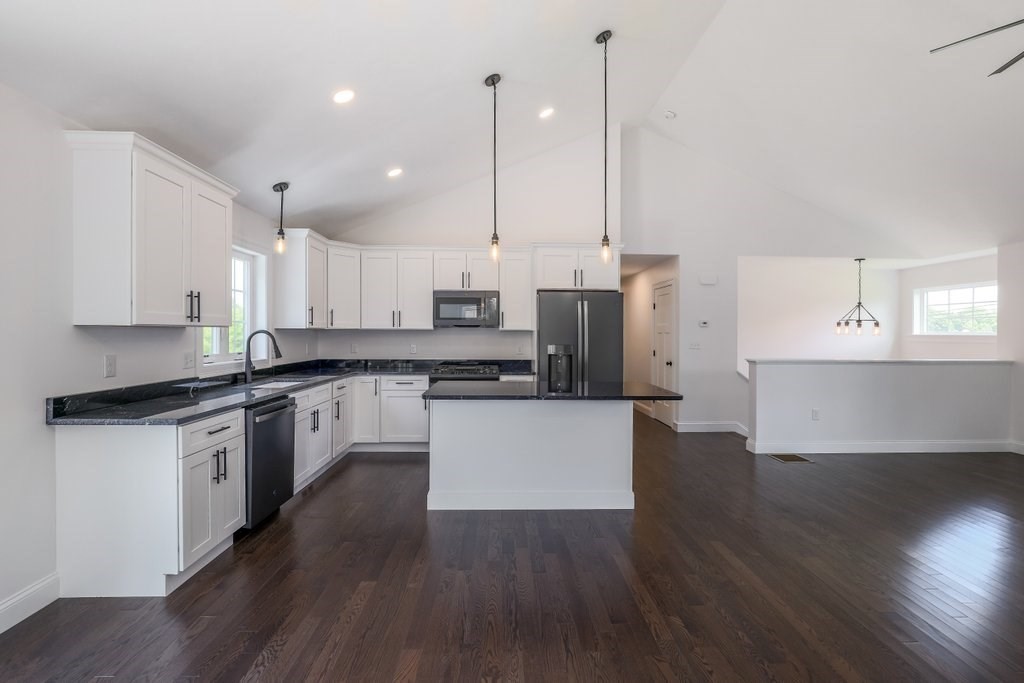 40 Jackson Lane Barre, MA 01005 - Photo 10 of 26 a large kitchen with stainless steel appliances kitchen island a large counter top and a wooden floors