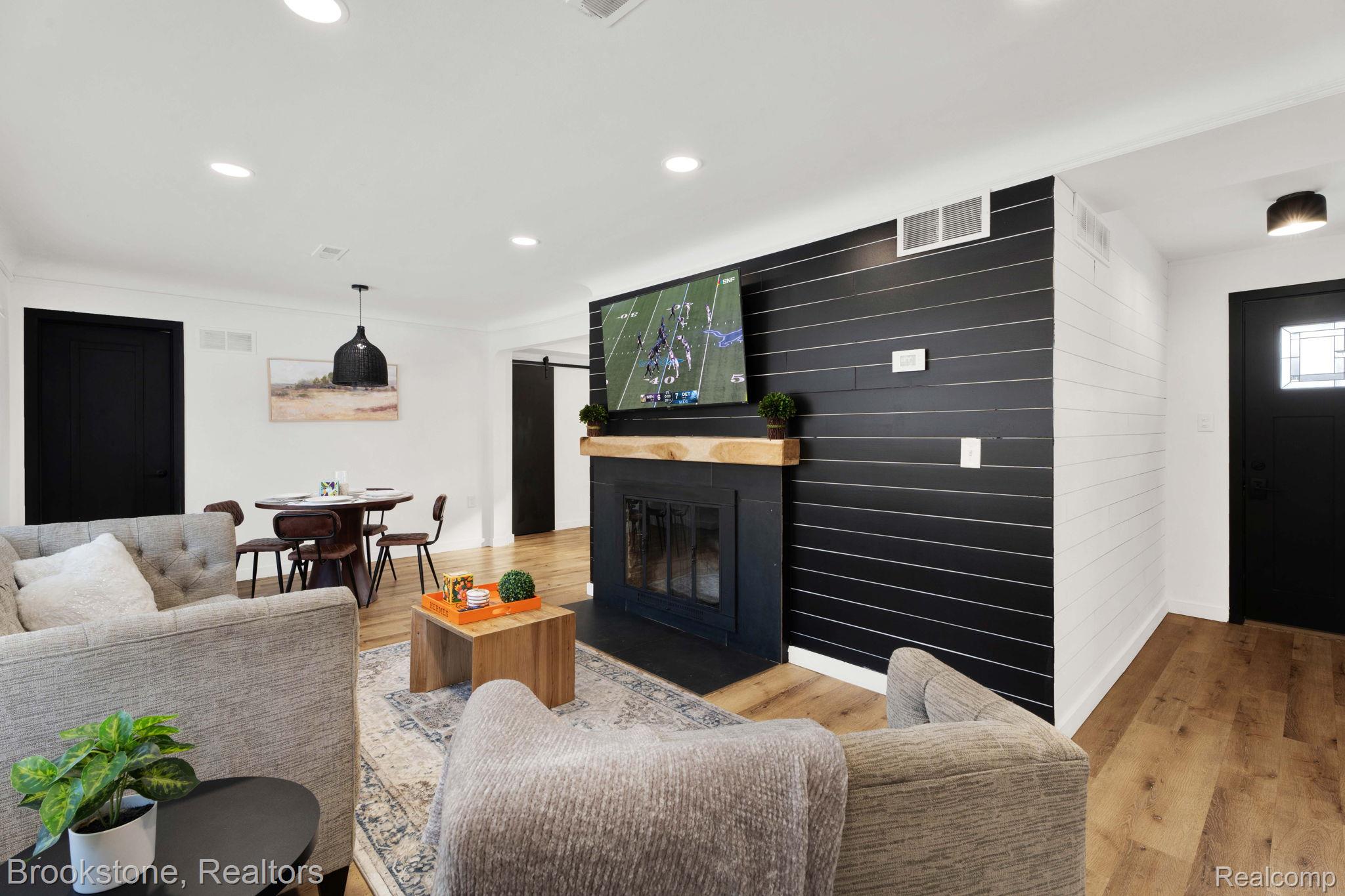 16046 West 13 Mile Road Franklin, MI 48025 - Photo 6 of 31 Living room featuring light wood finished floors, recessed lighting, and a fireplace with flush hearth