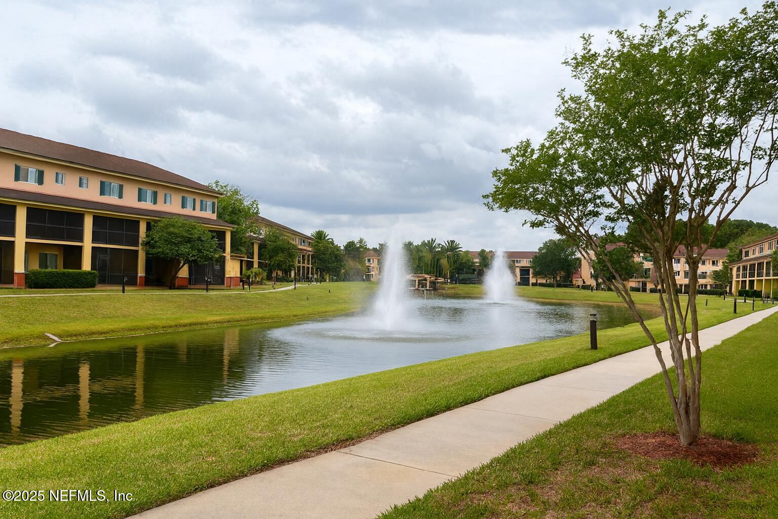 9745 Touchton Road, Unit 1701 Jacksonville, FL 32246 - Photo 22 of 30 a view of swimming pool with lawn chairs and plants