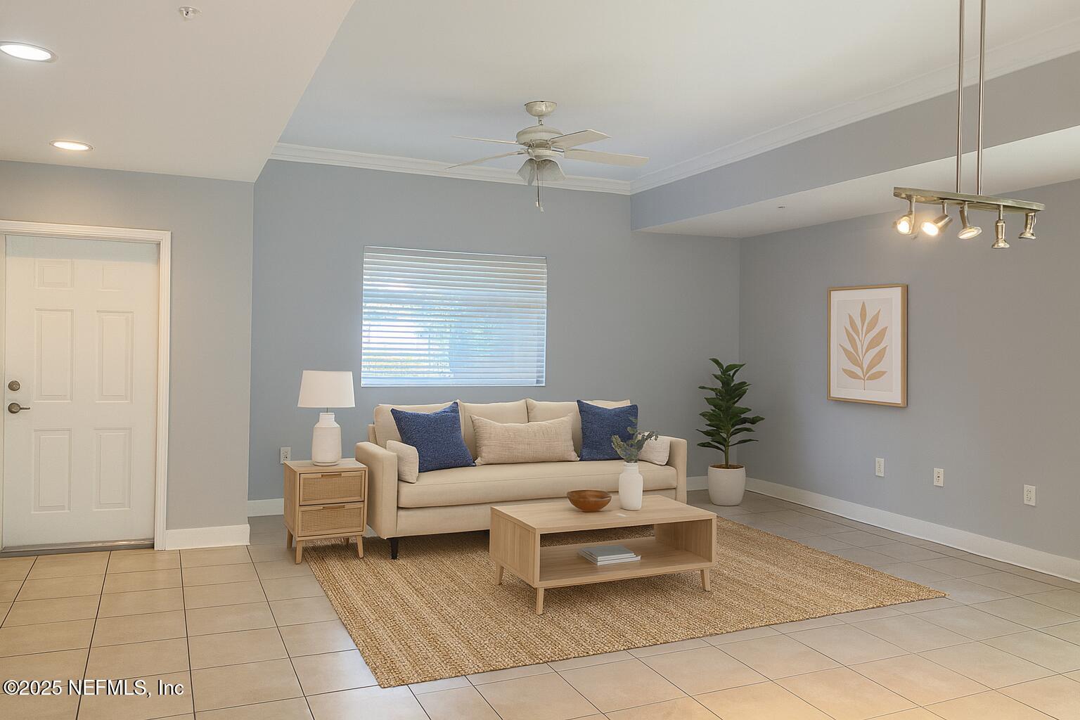 9745 Touchton Road, Unit 1701 Jacksonville, FL 32246 - Photo 4 of 30 a living room with furniture and a chandelier