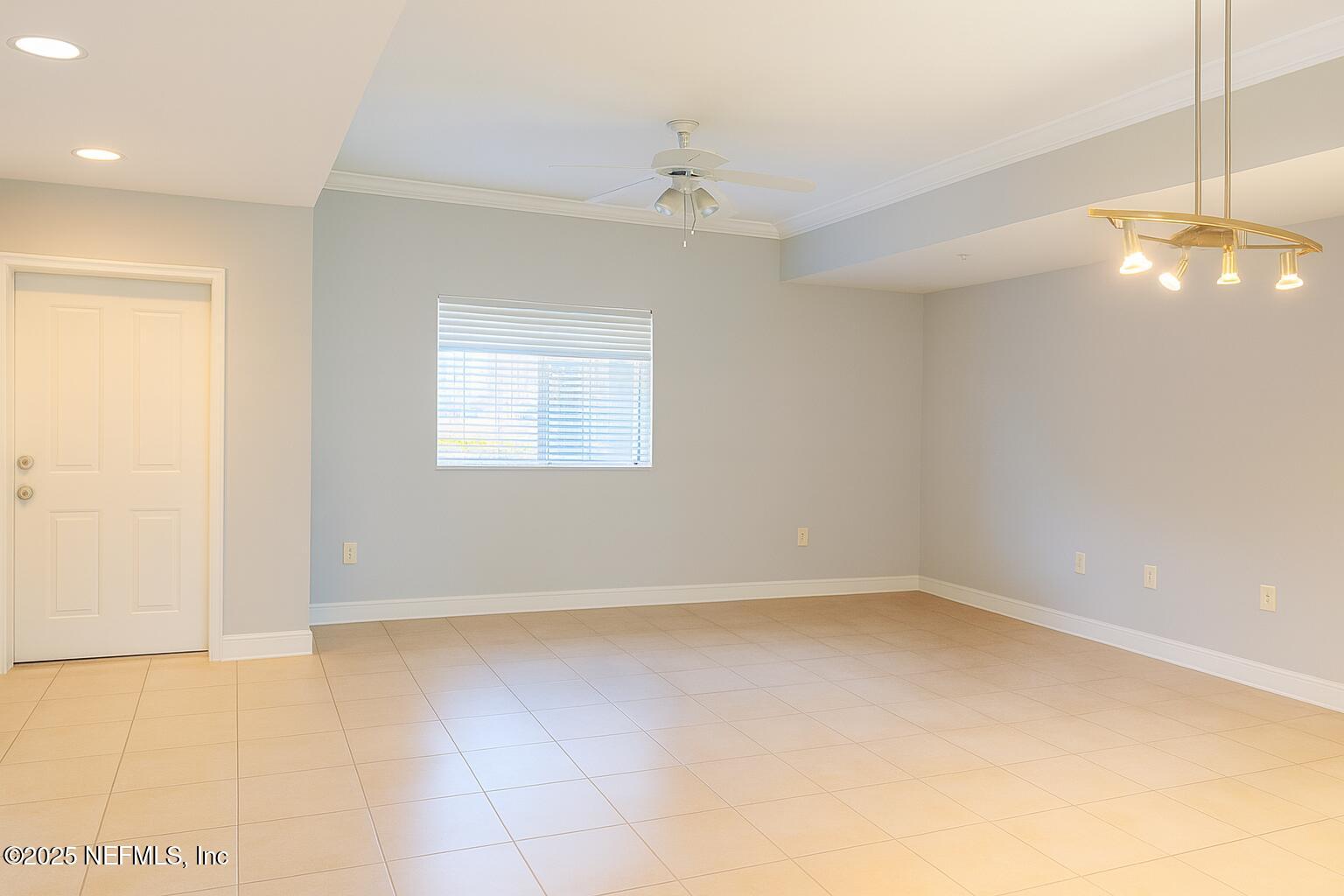 9745 Touchton Road, Unit 1701 Jacksonville, FL 32246 - Photo 5 of 30 an empty room with a empty space and a window