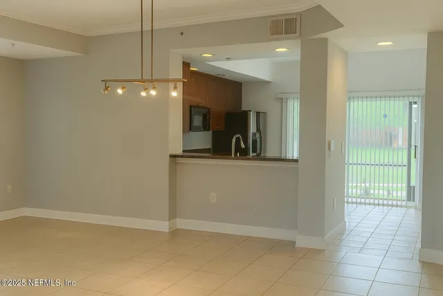 a kitchen with granite countertop a stove and a microwave