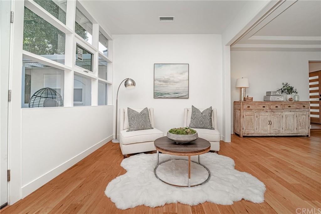 3880 Fairway Boulevard View Park, CA 90043 - Photo 11 of 47 a living room with furniture and a wooden floor