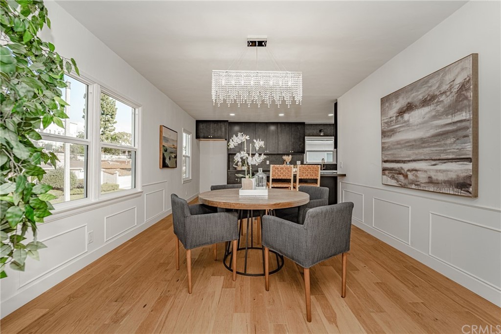 3880 Fairway Boulevard View Park, CA 90043 - Photo 12 of 47 a view of a dining room with furniture window and wooden floor