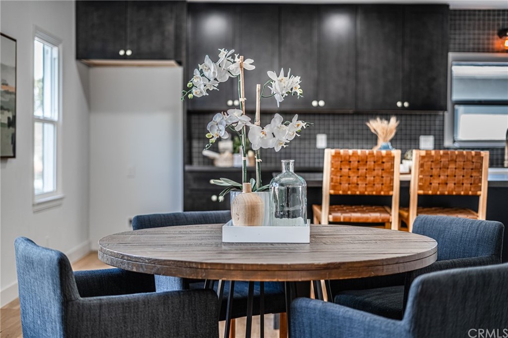 3880 Fairway Boulevard View Park, CA 90043 - Photo 13 of 47 a dining room with furniture and wooden floor