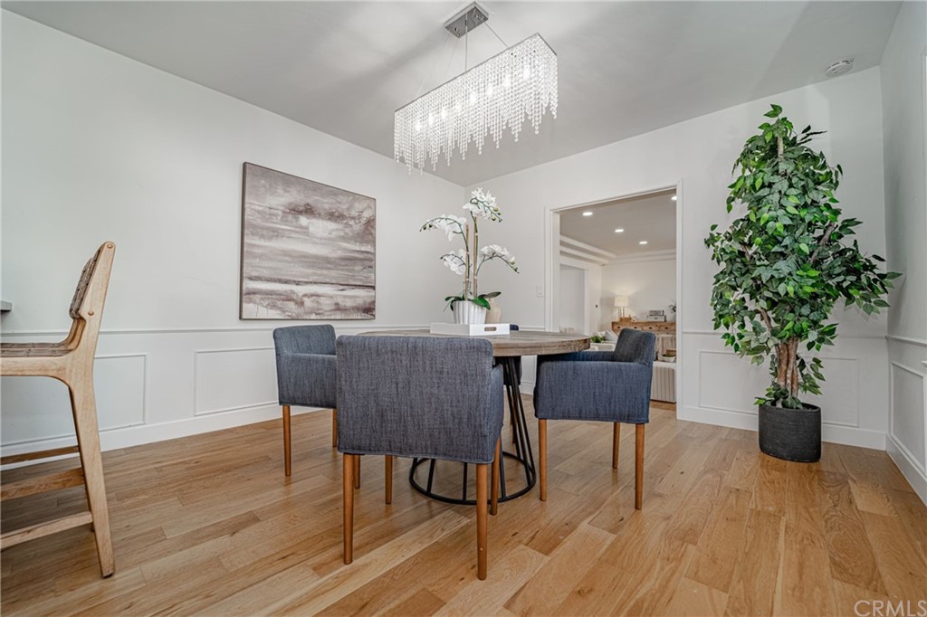 3880 Fairway Boulevard View Park, CA 90043 - Photo 15 of 47 a view of a dining room with furniture window and wooden floor
